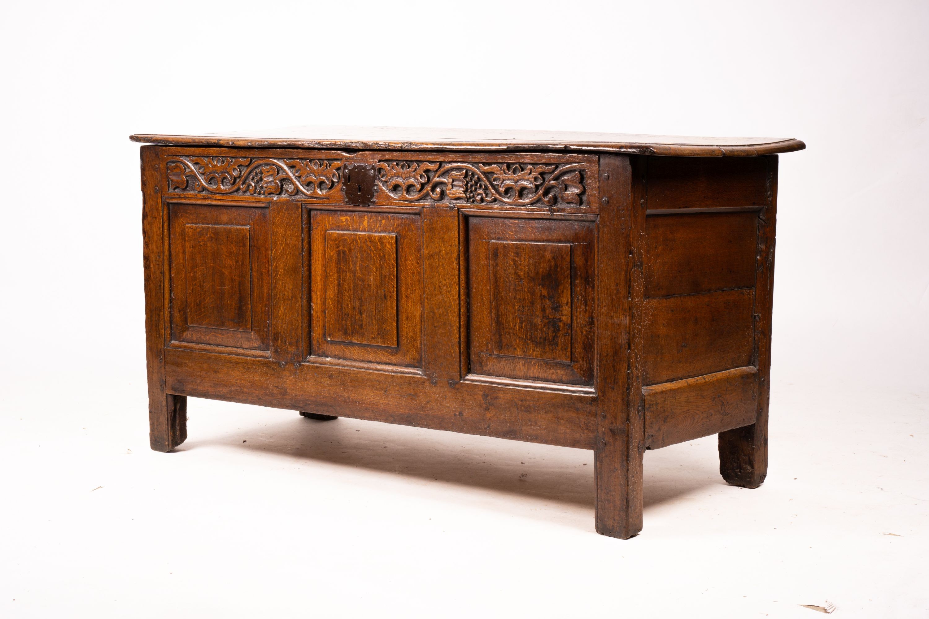 A 17th / 18th century carved oak coffer, length 132cm, depth 53cm, height 64cm